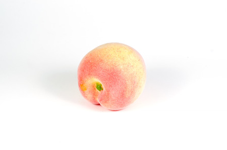Peach isolated on whiteの写真素材