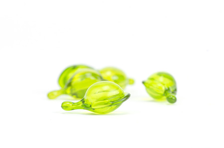 Many colorful pills isolated on whiteの写真素材