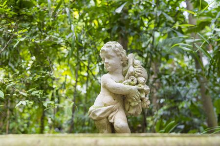 Cupid sculpture  in the gardenCupid sculpture  in the gardenの写真素材
