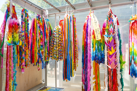 HIROSHIMA, JAPAN - APRIL 19: Paper cranes on April 19, 2015, Hiroshima, Japan. Japanese children make cranes from origami to remember the children victims of the nuclear attack.のeditorial素材