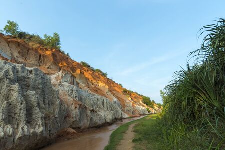 Landscape with river between red rocks and jungle Ham Tien canyon Mui ne, Vietnamの写真素材