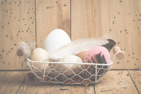 Easter eggs on wooden backgroundの写真素材