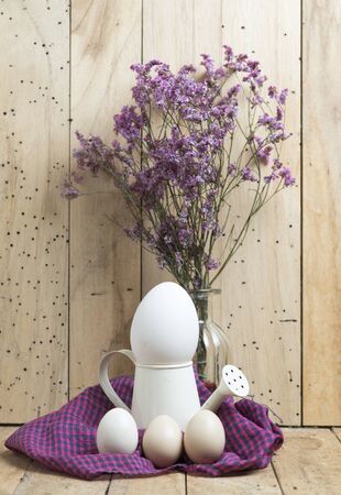 Easter eggs on wooden backgroundの写真素材