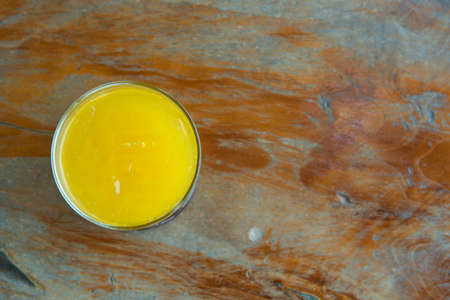 orange juice on wooden backgroundの写真素材