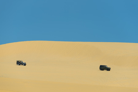 MUI NE - VIETNAM, JANUARY 18, 2016 : Tourists enjoy on the desert by jeep car in Mui ne, January 18, 2016のeditorial素材