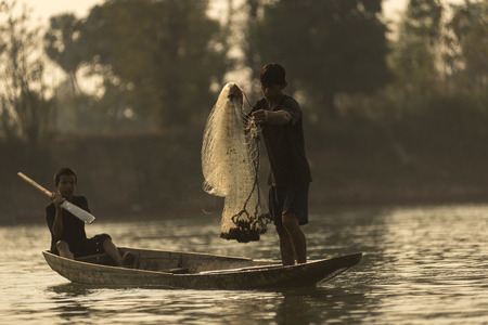Ubon Ratchathani, Thailand, January 3, 2016 :Fishermen along the banks of the Mekong river, Thailand and Laos.のeditorial素材