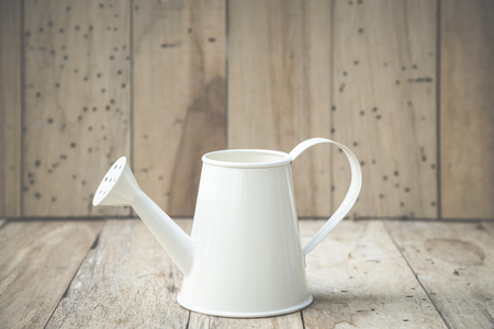 bucket of water on wood background, vintage filtered Imagesの写真素材