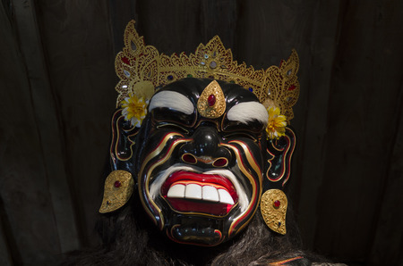 Traditional Balinese mask on a black background.の写真素材
