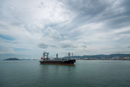 Cargo ship in the Gulf of Penang, Malaysiaの写真素材