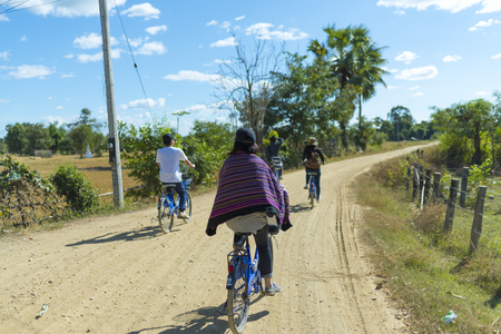 CHAMPASAK, LAOS - MAY 9: The Laos Local Field on MAY 9, 2016, in Champasak, Laos.Young tourists cycling trip in Laos .のeditorial素材