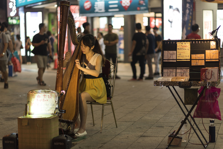 Taipei, Taiwan - November 12th 2016 - Locals and tourists enjoying the street market of Taipei downtown in Taiwan, Asiaのeditorial素材