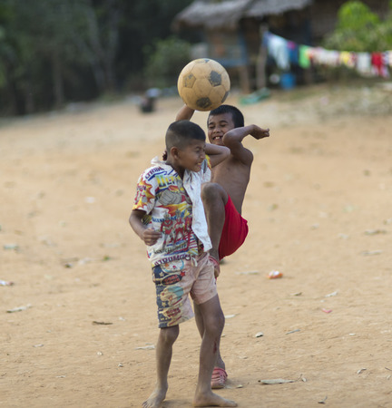 Sangkla Buri, Kanchanaburi, Thailand - November 19, 2016 : Little Mon people welcome tourists near the wooden bridge or Mon Bridgeのeditorial素材