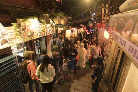 Jiufen,Taiwan - December 18 ,2016 : Tourists from all over the world walking and shopping in famous street night market in Jiufen. Jiufen is a mountain area in the Ruifang District of New Taipei Cityのeditorial素材