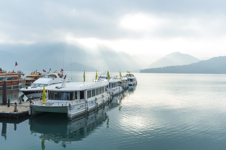Nantou, Taiwan - November 02, 2016 : Tourist boats docking in peachful morning at Shuishe Pier, Sun Moon Lake, Taiwan.のeditorial素材