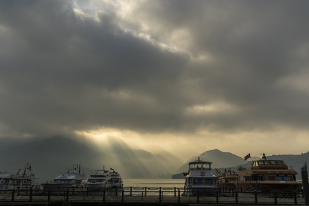 Nantou, Taiwan - November 02, 2016 : Tourist boats docking in peachful morning at Shuishe Pier, Sun Moon Lake, Taiwan.のeditorial素材