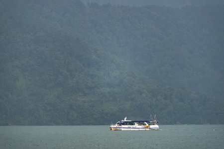 Nantou, Taiwan - November 02, 2016 : Tourist boats docking in peachful morning at Shuishe Pier, Sun Moon Lake, Taiwan.のeditorial素材