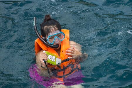Phuket, THAILAND - JANUARY 4, 2017. A tourist wearing a bikini swim in the sea in Phuket.のeditorial素材