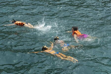 Phuket, THAILAND - JANUARY 4, 2017. A tourist wearing a bikini swim in the sea in Phuket.のeditorial素材