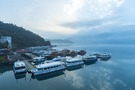 Nantou, Taiwan - November 02, 2016 : Tourist boats docking in peachful morning at Shuishe Pier, Sun Moon Lake, Taiwan.のeditorial素材
