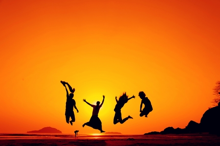 people Silhouettes with sunset, vintage filter imageの写真素材