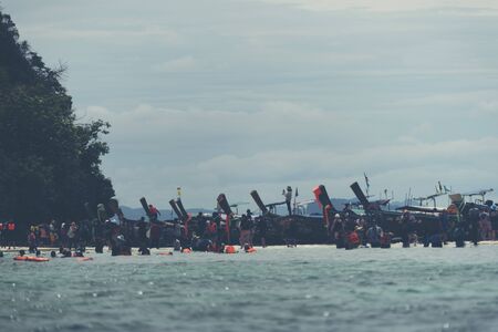 KRABI,THAILAND - April 14, 2017: Tourists enjoying the beautiful miracle beach & crystal clear water at Koh Kai, Koh Tub & Koh Mor, Krabi, Thaiandのeditorial素材