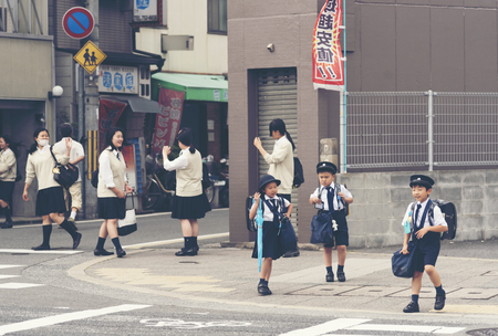 KYOTO,JAPAN, April 22, 2017: Japanese young students are coming back from elementary school in Kyoto, Japan.のeditorial素材
