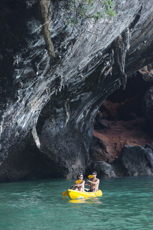 Phuket, THAILAND - March  4, 2017. A tourist wearing a bikini swim in the sea in Phuket.のeditorial素材