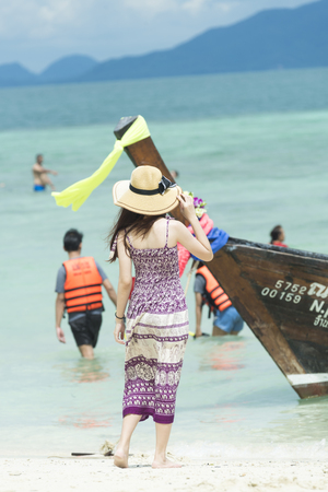 Phuket, THAILAND - March  4, 2017. A tourist wearing a bikini swim in the sea in Phuket.のeditorial素材