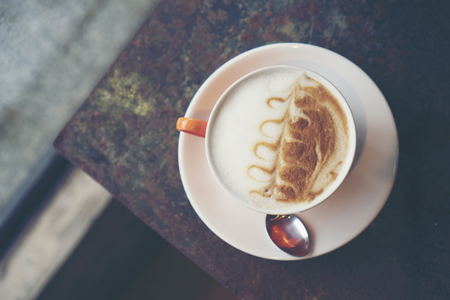 coffee latte art in coffee shop cafe, vintage filter imageの写真素材