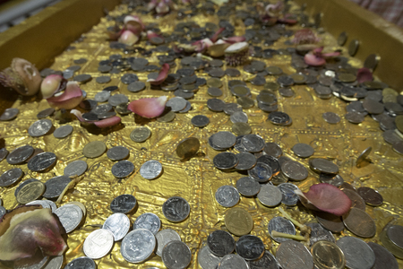 Kanchanaburi, THAILAND - JULY 8: Thai Buddhist monk hands holding candle cup at Sangklaburi temple on July 8, 2017 in Kanchanaburi, Thailand.のeditorial素材