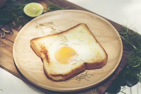 A healthy breakfast consisting of fried eggs, bread, vegetables and coffee.A healthy breakfast consisting of fried eggs, bread, vegetables and coffee.の写真素材