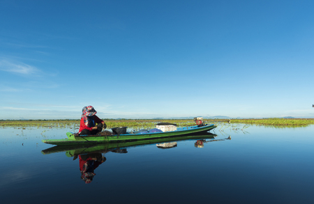 local boat on Bueng Boraphet lake, Nakonsawan, Thailandの写真素材