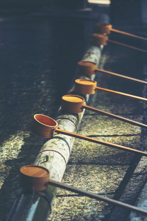 The Hishaku, Bamboo Japanese purification ladle, entrance of the Japanese templeの写真素材