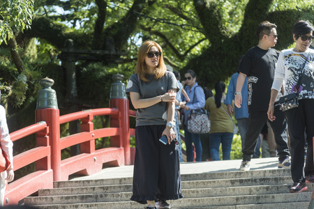 FUKUOKA,JAPAN-October 6, 2017: Many Tourists are walking pass the Torii gate of Dazaifu tenmangu shrine ,The most famous and ancient in Fukuoka, Japanのeditorial素材
