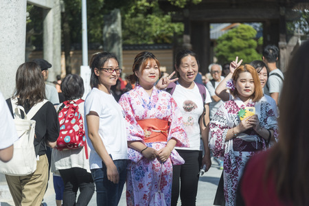 FUKUOKA,JAPAN-October 6, 2017: Many Tourists are walking pass the Torii gate of Dazaifu tenmangu shrine ,The most famous and ancient in Fukuoka, Japanのeditorial素材