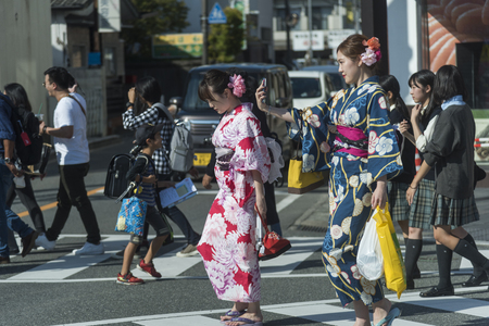 FUKUOKA,JAPAN-October 6, 2017: Many Tourists are walking pass the Torii gate of Dazaifu tenmangu shrine ,The most famous and ancient in Fukuoka, Japanのeditorial素材