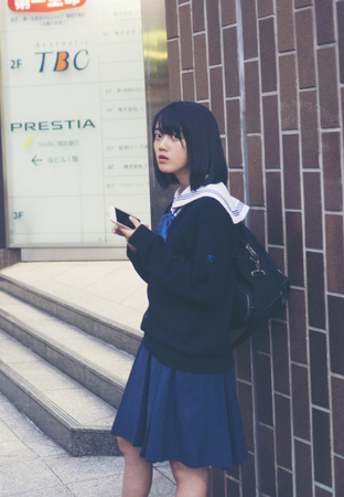 FUKUOKA, JAPAN-October 6, 2017: Many Tourists are walking pass the Torii gate of Dazaifu tenmangu shrine in the temple ,The most famous and ancient in Fukuoka, Japanのeditorial素材
