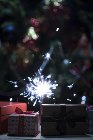 Christmas holding bengal burning sparkler lightの写真素材