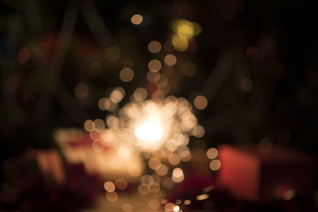 Christmas home room with tree and festive bokeh lighting, blurred holiday backgroundの写真素材