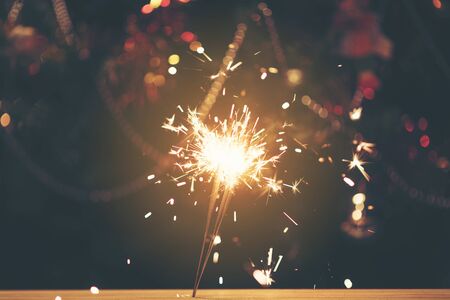 Sparkler with background Christmas light bokehの写真素材