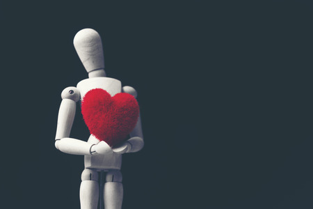 Valentines day red heart on old wood. Holidays background. Card for love.の写真素材