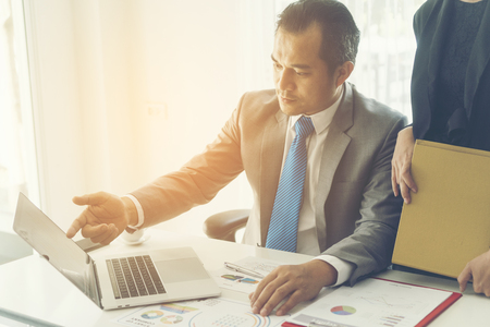 business couple working together on project at modern startup officeの写真素材