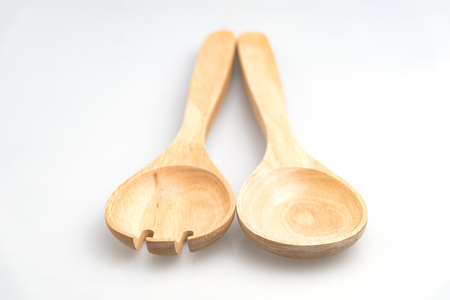 Kitchen accessories tools made of wood isolated on white backgroundの写真素材