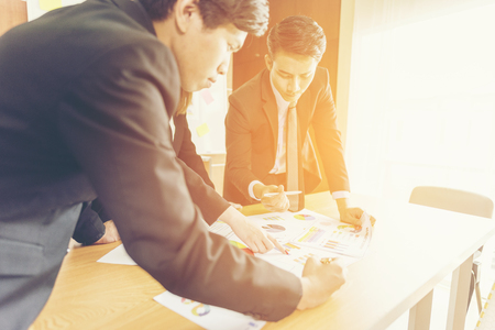 business couple working together on project at modern startup officeの写真素材