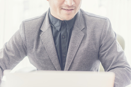 Business man working at office with laptop and documents on his desk, consultant lawyer conceptの写真素材