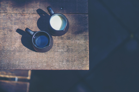 milk and syrup on cafe tableの写真素材