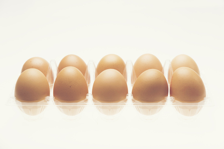chicken eggs isolated on whiteの写真素材