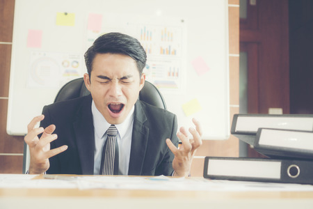 stressed business man in the officeの写真素材