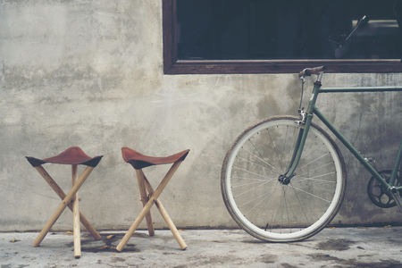 Three-legged camping chair, Made of wood and leather.の写真素材