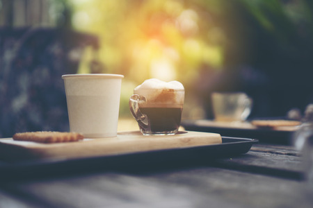 Coffee cup in coffee shop - vintage style effect pictureの写真素材